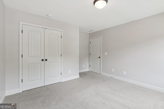 557 Winder Trl, Canton, GA 30114 - unfurnished bedroom featuring carpet floors and a closet