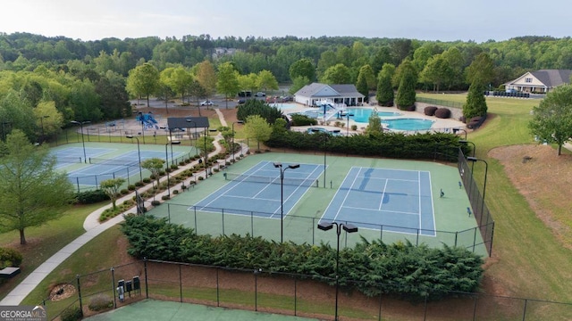 557 Winder Trl, Canton, GA 30114 - view of tennis court with a forest view