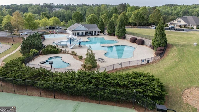 557 Winder Trl, Canton, GA 30114 - community pool featuring a patio and a view of trees
