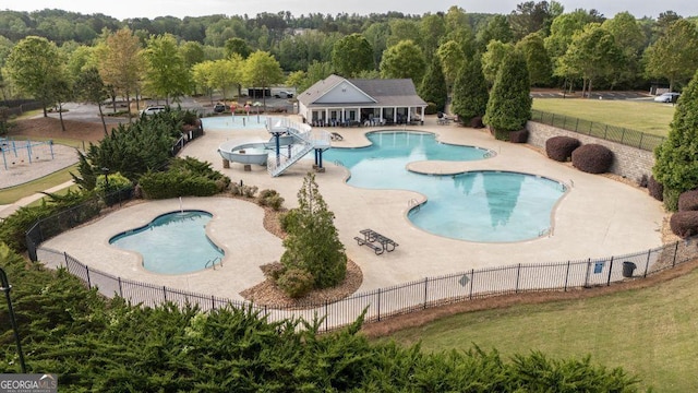 557 Winder Trl, Canton, GA 30114 - community pool with a patio and a wooded view