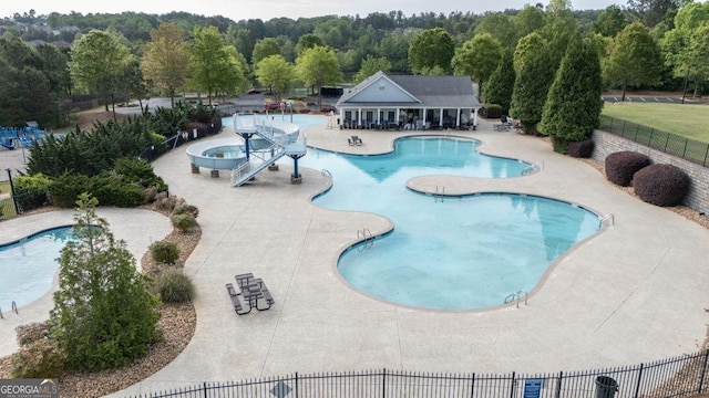 557 Winder Trl, Canton, GA 30114 - community pool with a patio area and a wooded view
