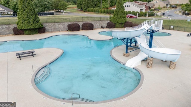 557 Winder Trl, Canton, GA 30114 - community pool with a water slide and a patio