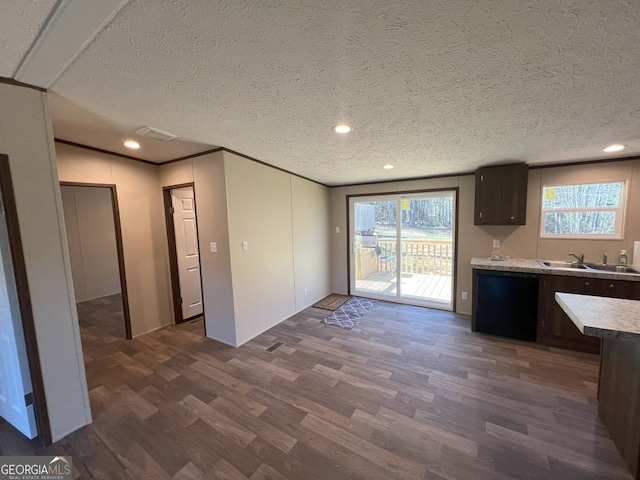 247 Hidden Valley Dr, Alto, GA 30510 - kitchen featuring light countertops, dark wood-style flooring, a sink, visible vents, and black dishwasher