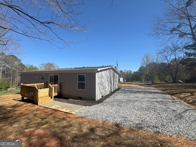 247 Hidden Valley Dr, Alto, GA 30510 - rear view of house with crawl space, gravel driveway, and a deck