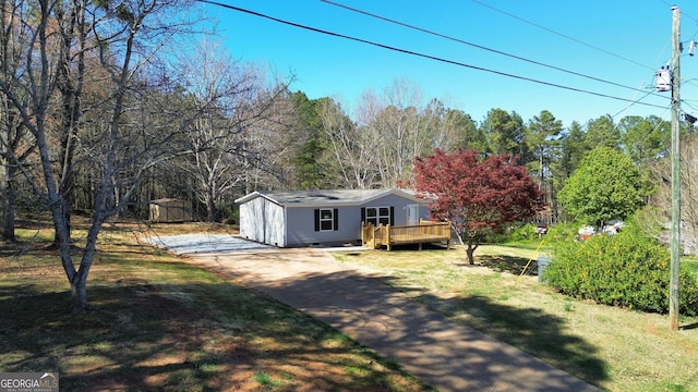 247 Hidden Valley Dr, Alto, GA 30510 - view of front facade with a front lawn, a wooden deck, an outdoor structure, and concrete driveway
