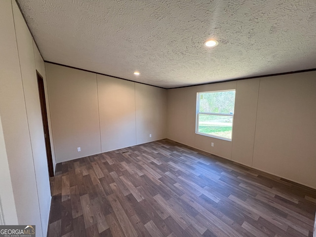 247 Hidden Valley Dr, Alto, GA 30510 - spare room with dark wood finished floors, crown molding, and a textured ceiling