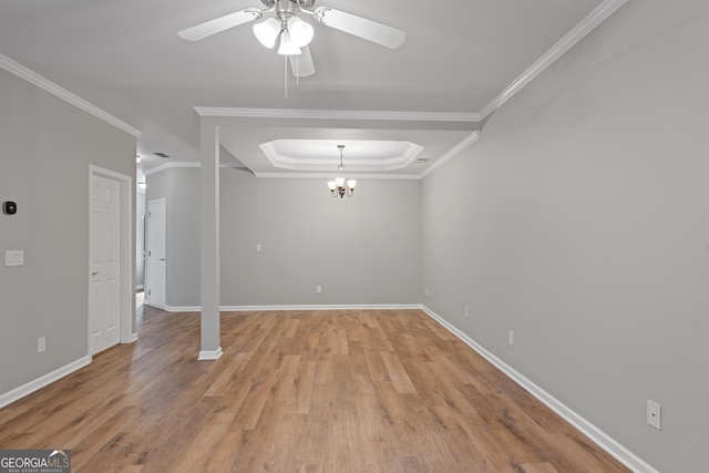 145 Sunset Ln, Woodstock, GA 30189 - unfurnished living room with ceiling fan, a chandelier, a raised ceiling, baseboards, and crown molding