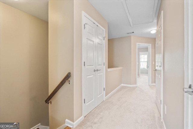 145 Sunset Ln, Woodstock, GA 30189 - hallway with an upstairs landing, attic access, carpet, and baseboards
