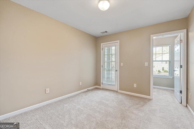 145 Sunset Ln, Woodstock, GA 30189 - empty room with healthy amount of natural light, light colored carpet, and baseboards