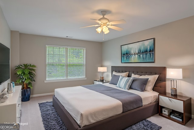 145 Sunset Ln, Woodstock, GA 30189 - bedroom featuring light colored carpet, baseboards, and a ceiling fan
