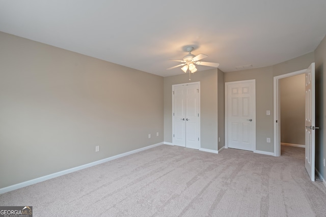 145 Sunset Ln, Woodstock, GA 30189 - unfurnished bedroom featuring baseboards, carpet flooring, ceiling fan, and a closet