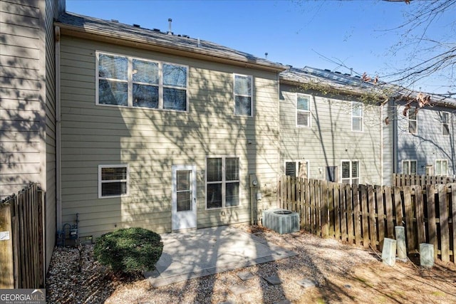 145 Sunset Ln, Woodstock, GA 30189 - rear view of property with central AC unit, fence, and a patio area