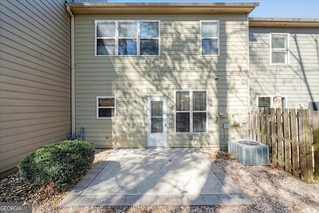 145 Sunset Ln, Woodstock, GA 30189 - rear view of property with central AC, a patio area, and fence