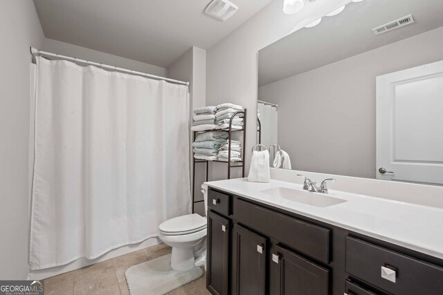 4030 Amberhill Cir, Cumming, GA 30040 - bathroom featuring curtained shower, visible vents, toilet, and vanity