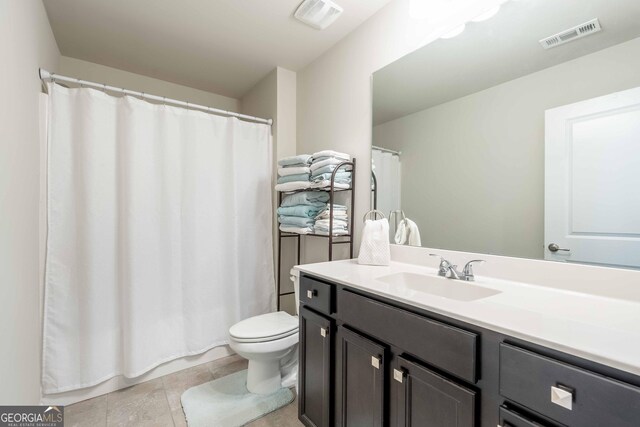 4030 Amberhill Cir, Cumming, GA 30040 - bathroom featuring visible vents, toilet, a shower with shower curtain, and vanity