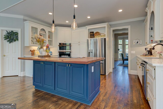 8155 Legends View Ct, Cumming, GA 30028 - kitchen featuring wood counters, blue cabinets, open shelves, appliances with stainless steel finishes, and white cabinets