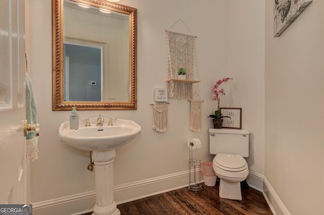 8155 Legends View Ct, Cumming, GA 30028 - bathroom featuring wood finished floors, toilet, and baseboards