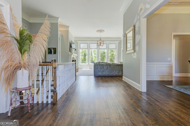 8155 Legends View Ct, Cumming, GA 30028 - foyer entrance featuring a chandelier, wood finished floors, ornamental molding, a wainscoted wall, and baseboards