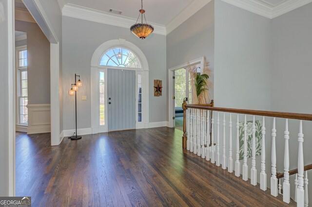 8155 Legends View Ct, Cumming, GA 30028 - foyer featuring dark wood-type flooring, crown molding, a high ceiling, and baseboards