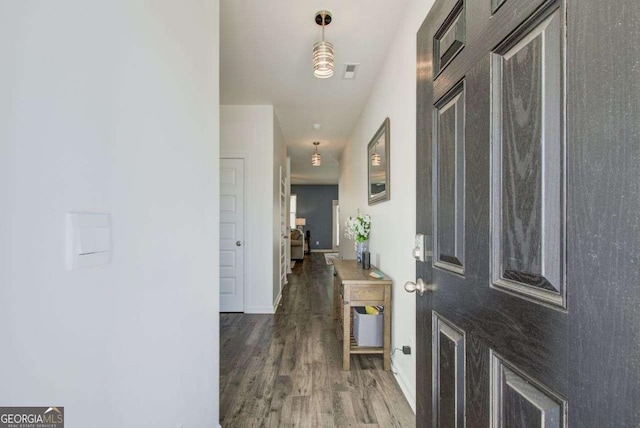 221 Sullivan St, Hampton, GA 30228 - foyer entrance with baseboards, visible vents, and wood finished floors