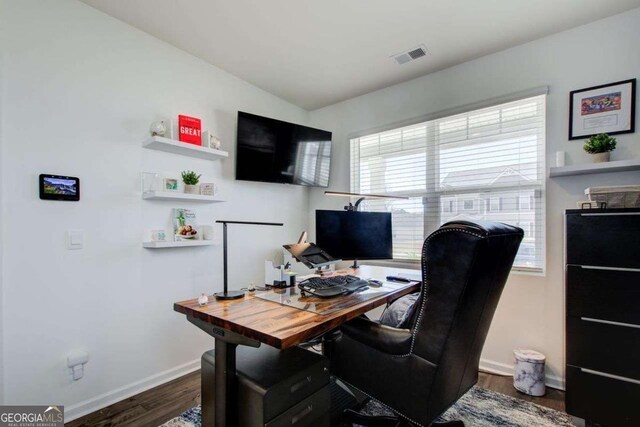 221 Sullivan St, Hampton, GA 30228 - office featuring dark wood-type flooring, baseboards, and visible vents