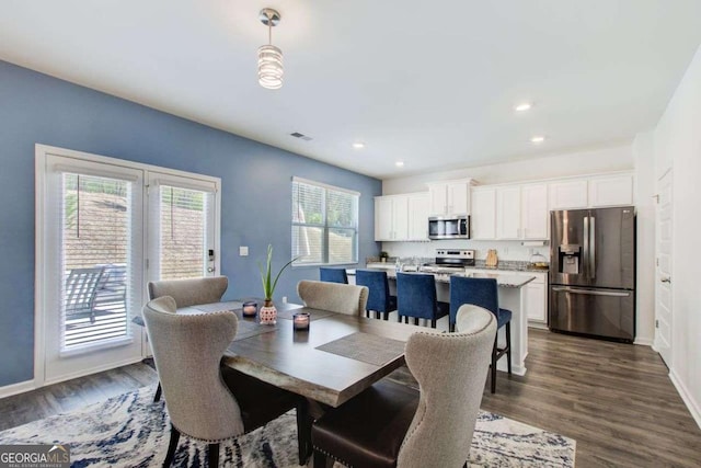 221 Sullivan St, Hampton, GA 30228 - dining area with dark wood-style flooring, visible vents, baseboards, and recessed lighting