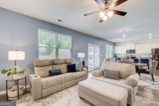 221 Sullivan St, Hampton, GA 30228 - living area with light wood-style flooring, visible vents, baseboards, recessed lighting, and a ceiling fan
