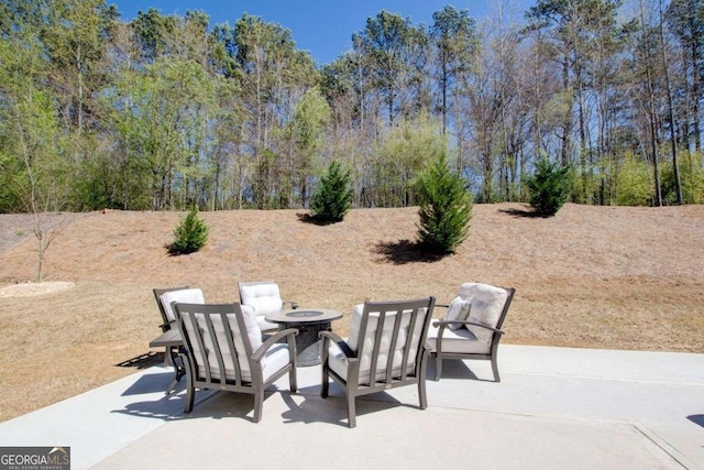 221 Sullivan St, Hampton, GA 30228 - view of patio featuring an outdoor fire pit