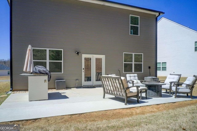 221 Sullivan St, Hampton, GA 30228 - back of house featuring an outdoor living space, cooling unit, and a patio
