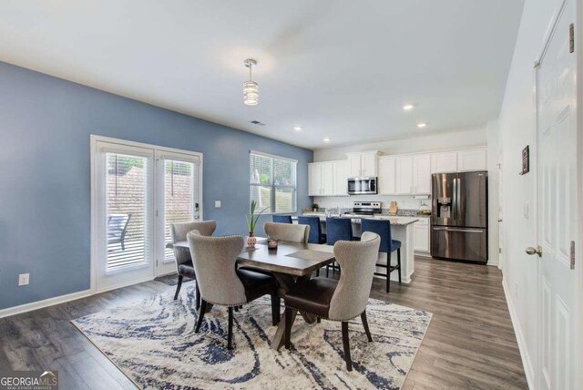 221 Sullivan St, Hampton, GA 30228 - dining space with recessed lighting, baseboards, and dark wood finished floors