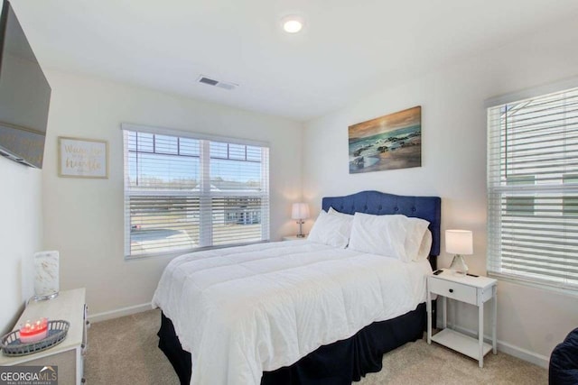 221 Sullivan St, Hampton, GA 30228 - bedroom featuring baseboards, visible vents, and light colored carpet