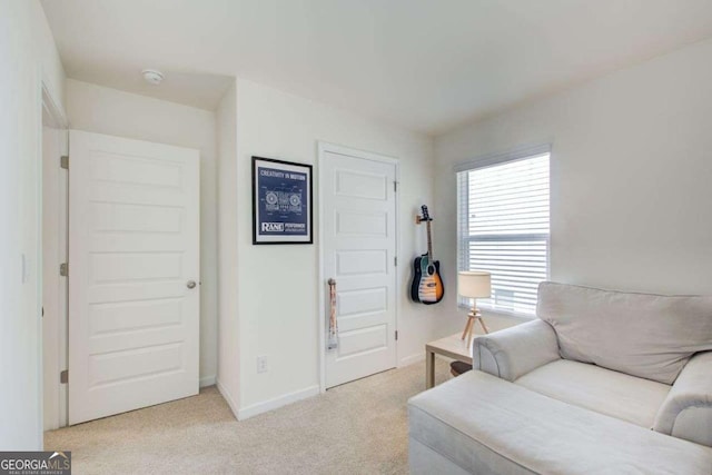 221 Sullivan St, Hampton, GA 30228 - living room with light carpet and baseboards