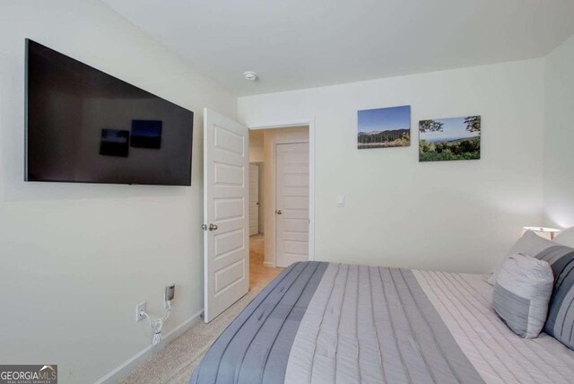 221 Sullivan St, Hampton, GA 30228 - bedroom featuring baseboards and light colored carpet