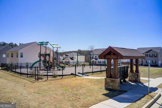 221 Sullivan St, Hampton, GA 30228 - community playground with a residential view and fence