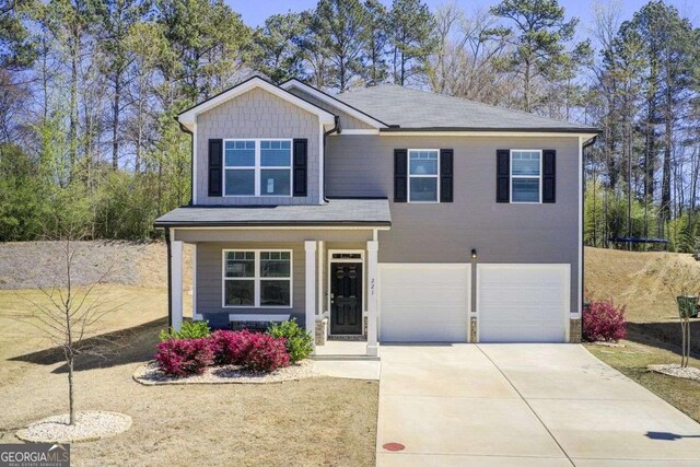 221 Sullivan St, Hampton, GA 30228 - view of front of house with concrete driveway and an attached garage