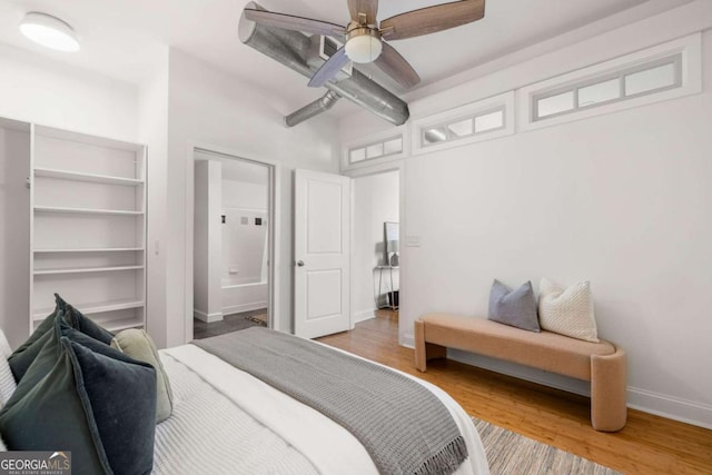 bedroom featuring baseboards, ceiling fan, and wood finished floors