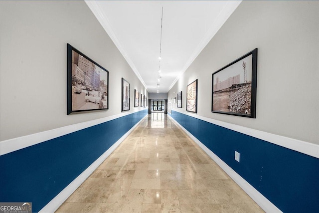 hallway with baseboards and ornamental molding