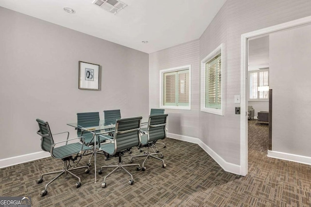 office featuring carpet flooring, baseboards, and visible vents