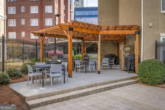 view of patio with a grill, fence, outdoor dining area, and a pergola