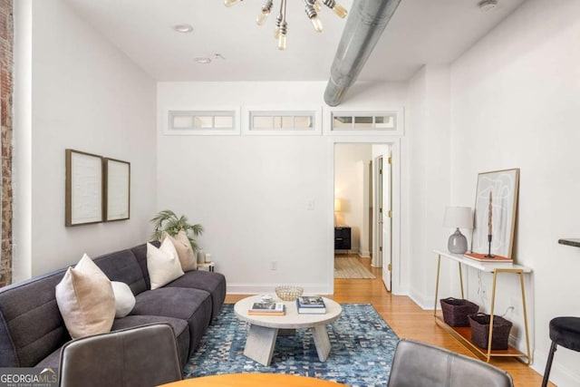 living room featuring baseboards and wood finished floors