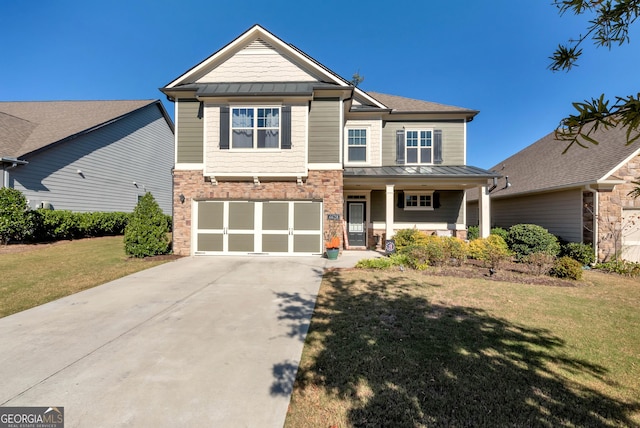 craftsman-style house with a porch, a standing seam roof, driveway, a front yard, and an attached garage