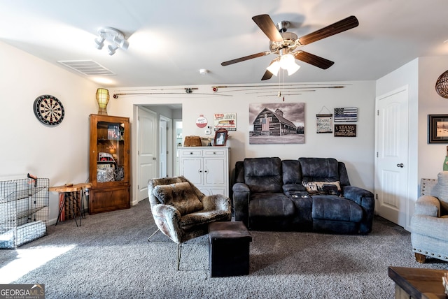 carpeted living room with visible vents and ceiling fan