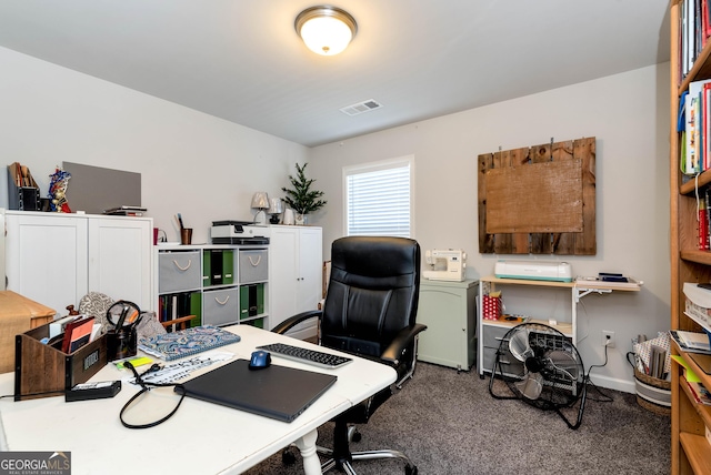 carpeted home office with visible vents