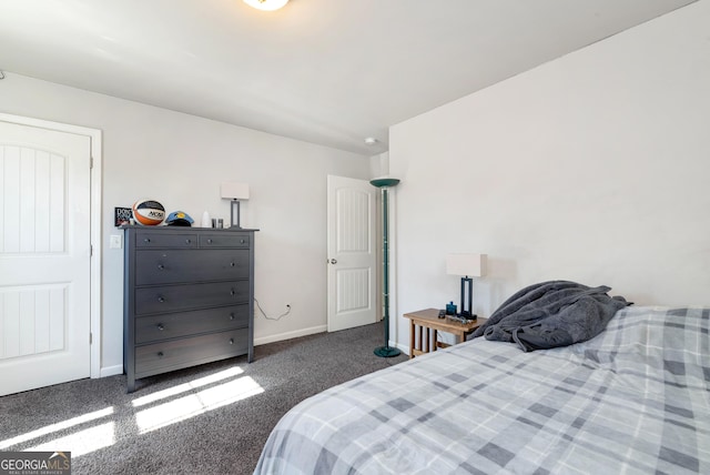 carpeted bedroom featuring baseboards