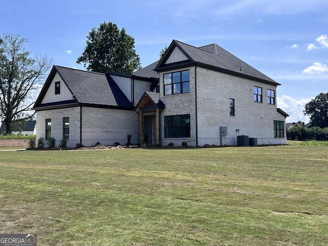 699 Rambler Inn Rd, Jefferson, GA 30549 - view of front of home featuring brick siding, a front lawn, and board and batten siding