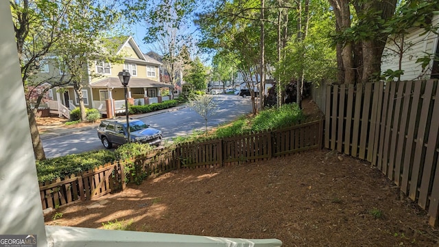 234 Carlyle Park Dr NE, Atlanta, GA 30307 - kitchen with pendant lighting, dark countertops, a peninsula, and wood finished floors