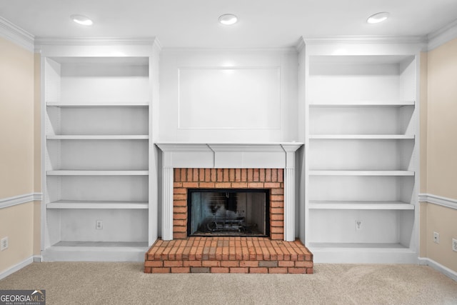 unfurnished living room with a fireplace, crown molding, carpet flooring, and baseboards