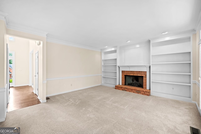 unfurnished living room with carpet, visible vents, ornamental molding, baseboards, and built in features