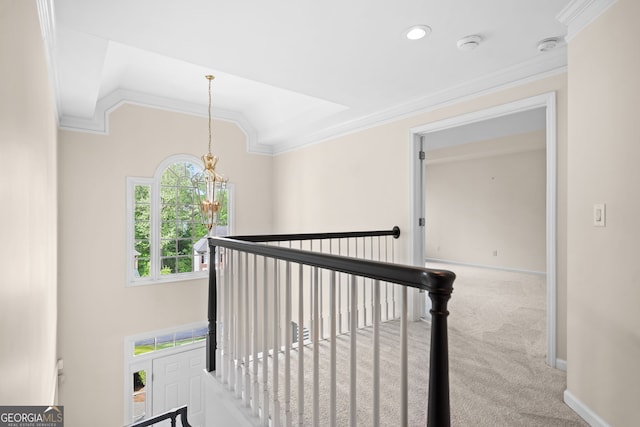 staircase with an inviting chandelier, carpet floors, lofted ceiling, ornamental molding, and recessed lighting