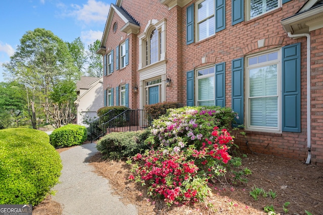 view of property exterior featuring brick siding
